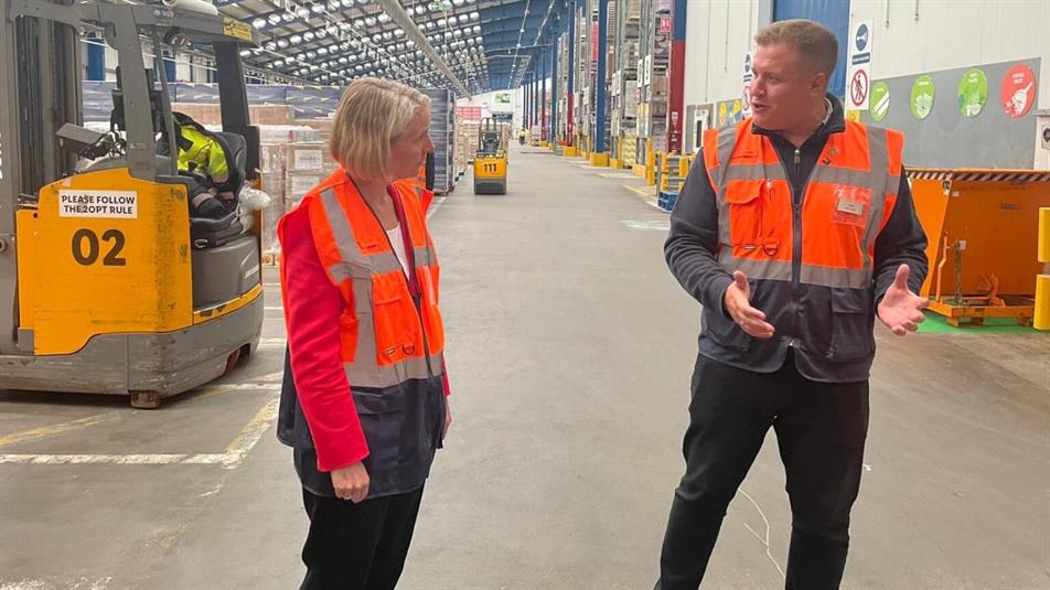 Reynolds (left) at Lidl warehouse